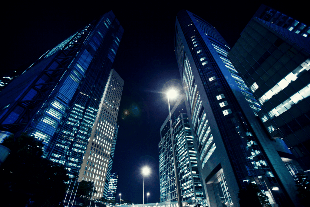Nighttime view of tall office buildings illuminated with emergency lighting